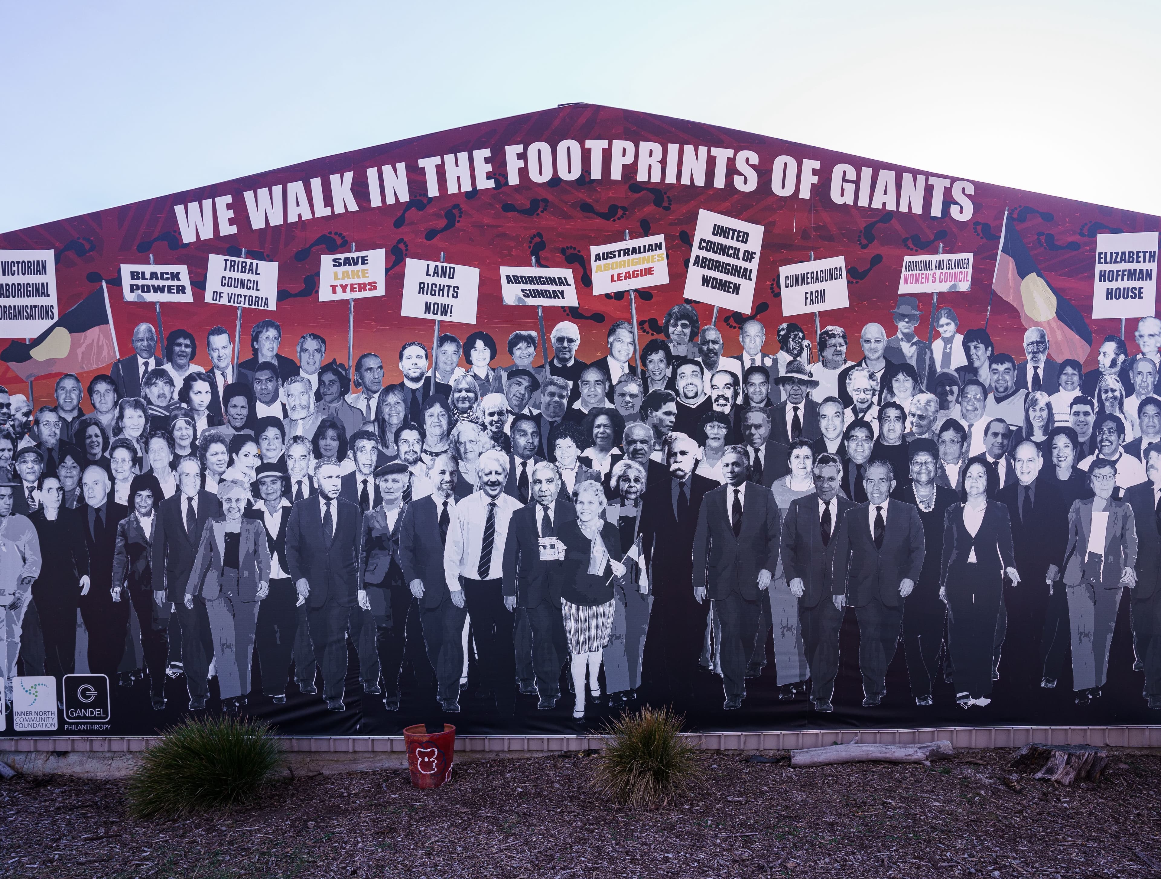 Mural of Board members of the Aborigines Advancement League for 60 years from 1957-2017 under the words "We Walk in the footprints of giants".