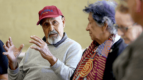 Uncle Colin Walker in animated discussion with Yoorrook Chair Aunty Eleanor Bourke.