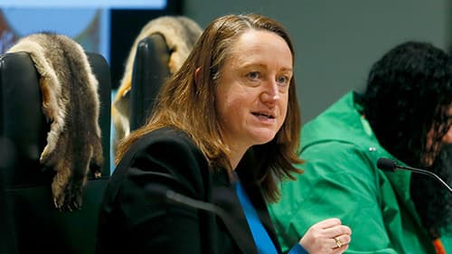 Sarah Gafforini, VACCA, leans forward in her chair to talk into her microphone at a Yoorrook public hearing.